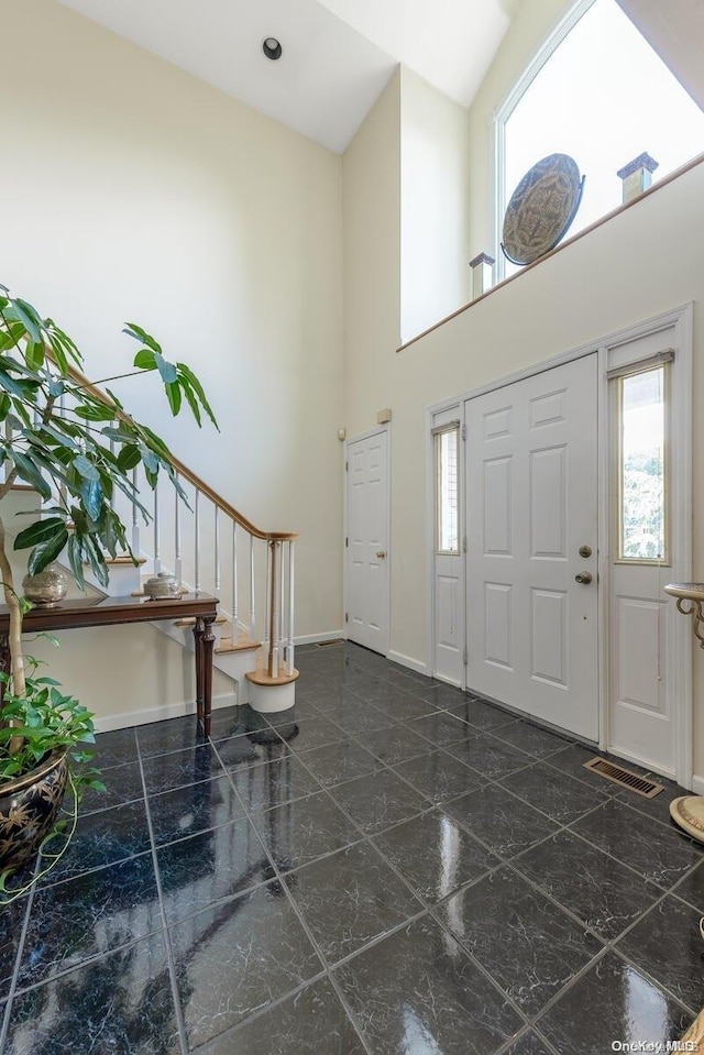 entryway with a high ceiling