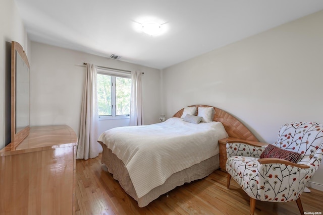 bedroom with light hardwood / wood-style floors