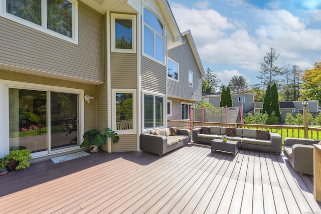 wooden terrace with an outdoor hangout area