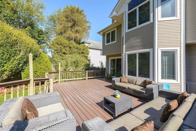 wooden deck featuring an outdoor hangout area