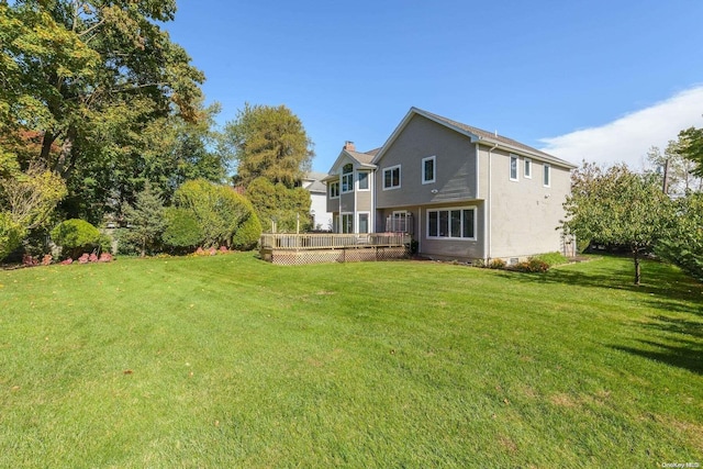 view of yard with a deck