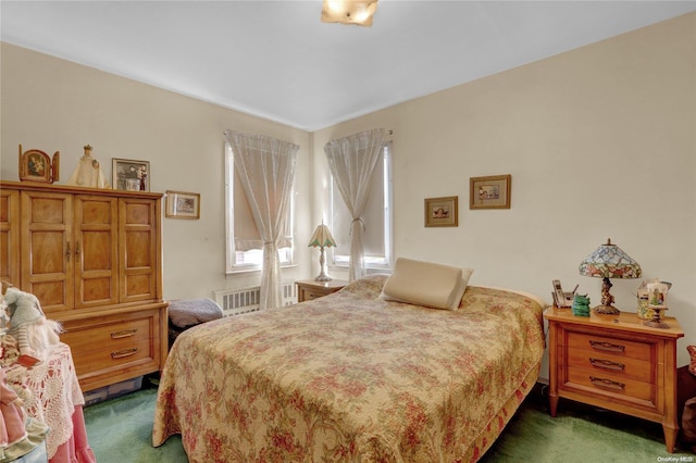 carpeted bedroom with radiator