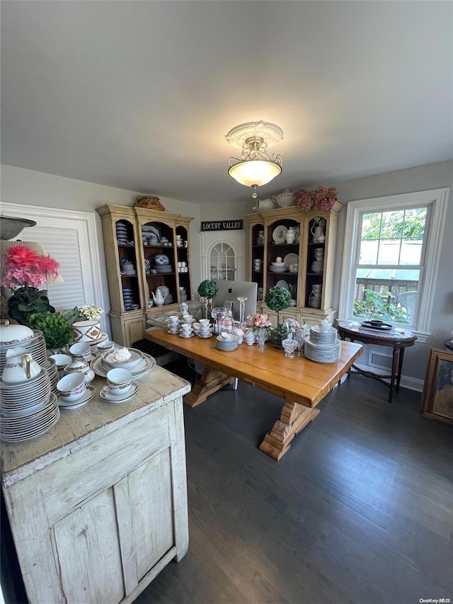 dining room with dark hardwood / wood-style floors