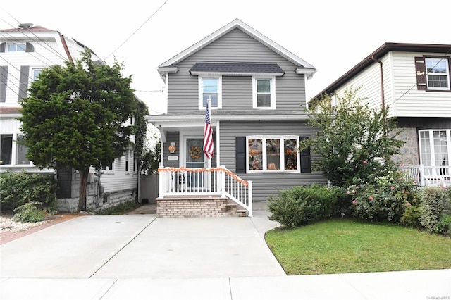 view of property with a front lawn