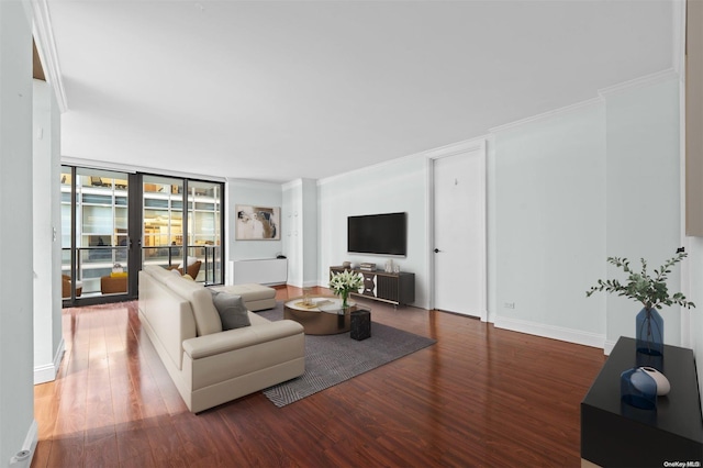 living room with hardwood / wood-style floors, expansive windows, and crown molding