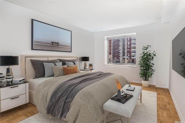 bedroom featuring light parquet floors