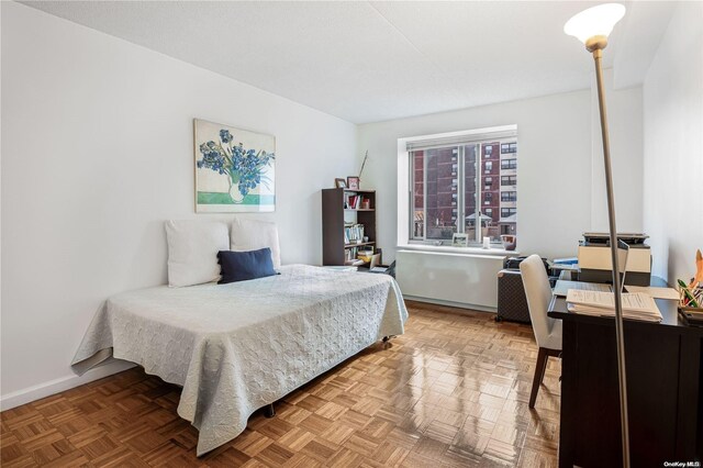 bedroom featuring parquet floors