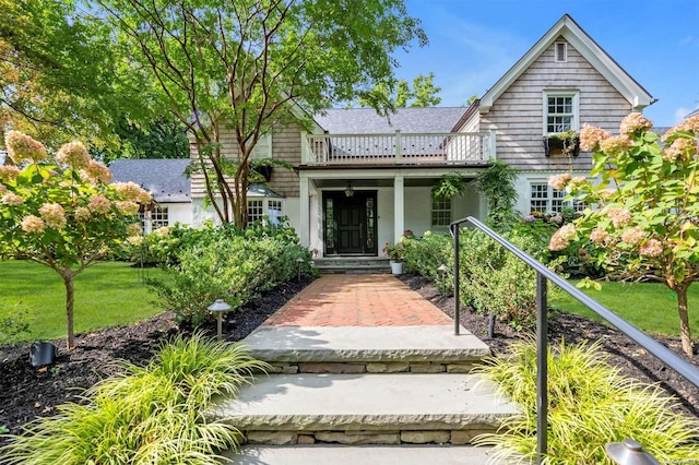 front of property featuring a balcony