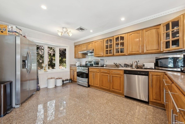 kitchen featuring sink, ornamental molding, and stainless steel appliances