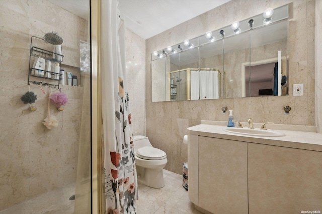 bathroom featuring an enclosed shower, vanity, toilet, and tile walls