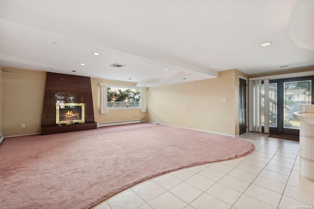 unfurnished living room featuring light tile patterned floors and a baseboard heating unit