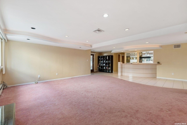 unfurnished living room featuring light colored carpet