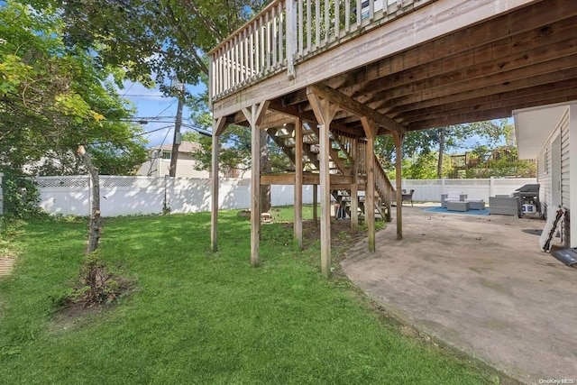 view of yard featuring a patio and a deck