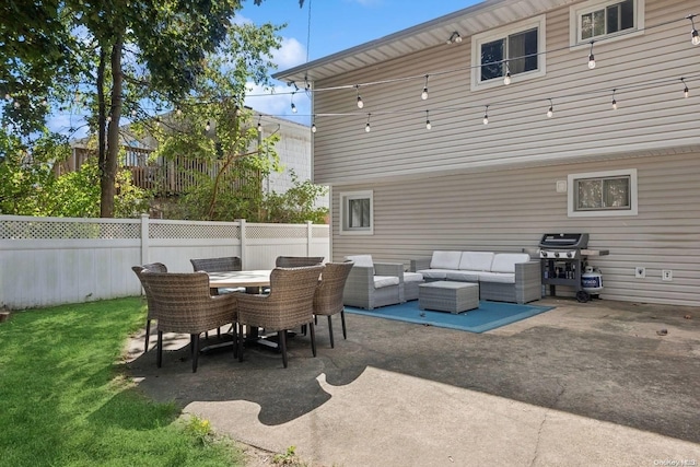 view of patio with area for grilling and outdoor lounge area