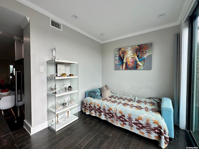 bedroom featuring ornamental molding and dark hardwood / wood-style floors