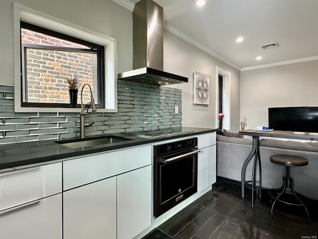 kitchen featuring white cabinetry, sink, black appliances, dark wood-type flooring, and wall chimney exhaust hood