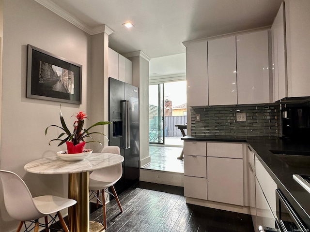 kitchen featuring dark hardwood / wood-style floors, white cabinetry, decorative backsplash, plenty of natural light, and high end fridge