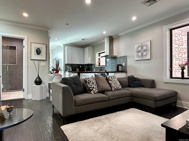 living room featuring crown molding and dark hardwood / wood-style floors