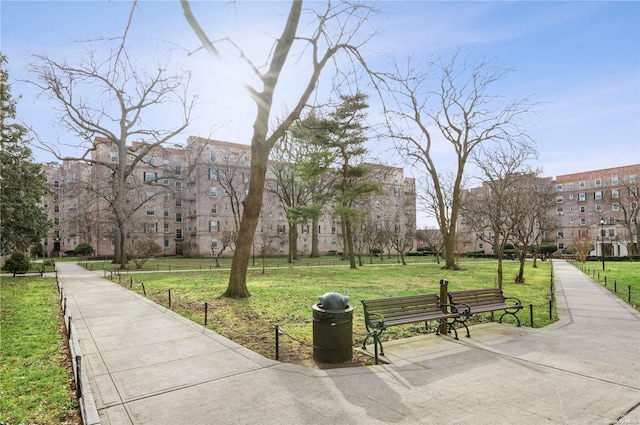 view of property's community featuring a yard