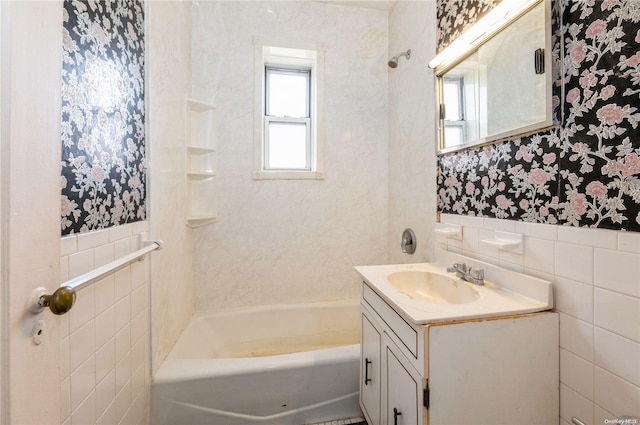 bathroom featuring vanity and tile walls