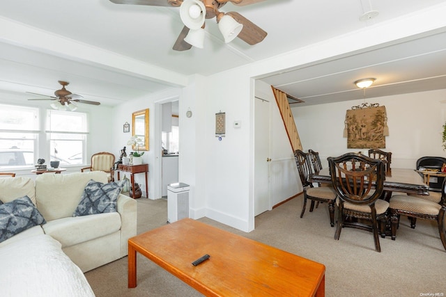 carpeted living room featuring ceiling fan