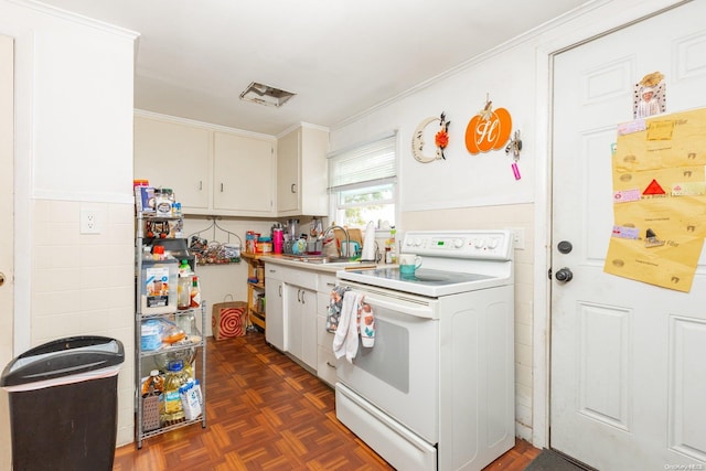 kitchen featuring dark parquet flooring, white cabinets, sink, ornamental molding, and white range with electric stovetop