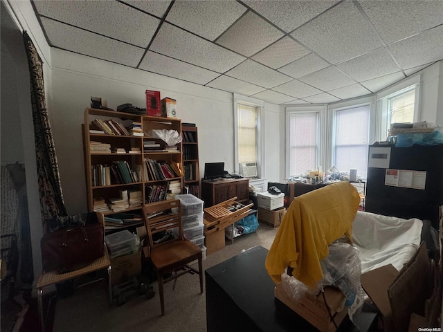 interior space with carpet and a drop ceiling