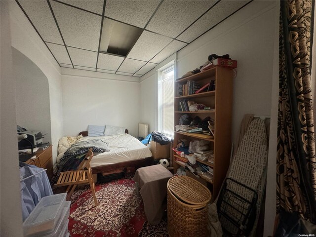 bedroom with a paneled ceiling