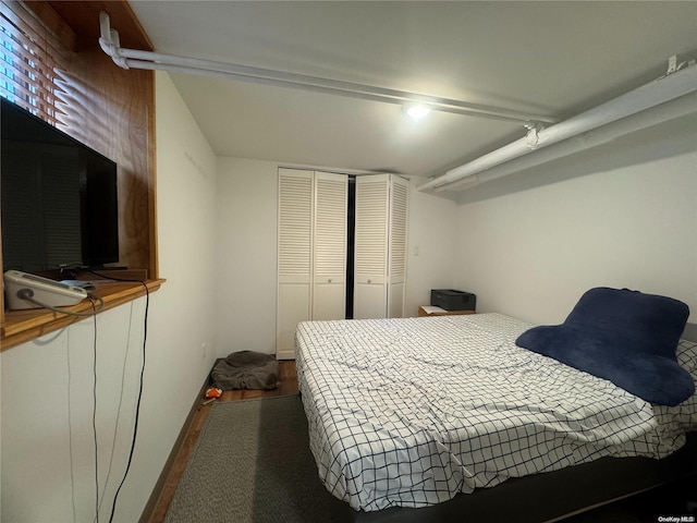 bedroom featuring wood-type flooring