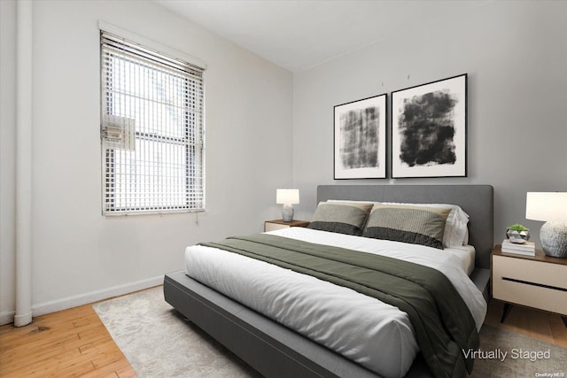 bedroom featuring hardwood / wood-style flooring