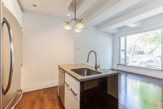 kitchen with sink, stainless steel appliances, dark hardwood / wood-style floors, a center island with sink, and white cabinets