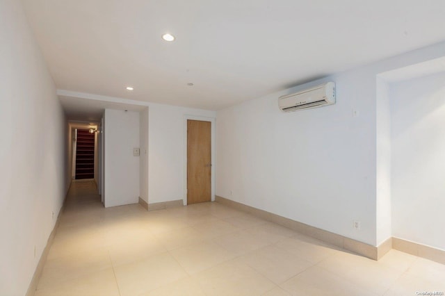 empty room featuring a wall mounted air conditioner