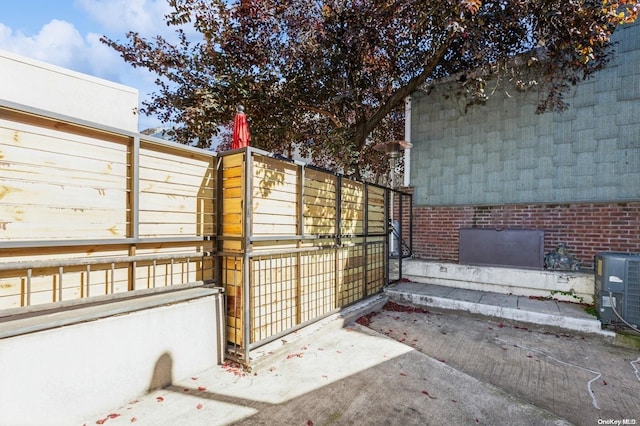 view of gate featuring central AC unit