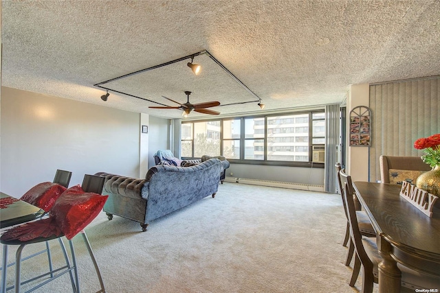 carpeted living room featuring ceiling fan, a textured ceiling, and a baseboard radiator