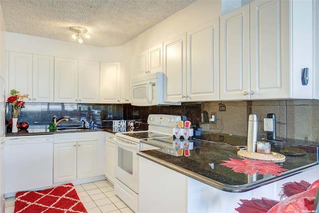 kitchen featuring white appliances, backsplash, light tile patterned floors, a textured ceiling, and white cabinetry