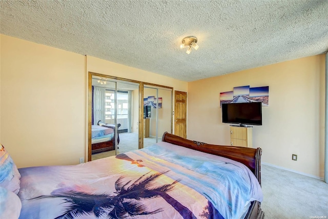 bedroom with carpet, a textured ceiling, and a closet