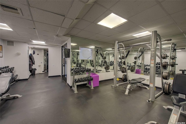 gym featuring a drop ceiling