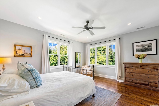 bedroom featuring ceiling fan and dark wood-type flooring