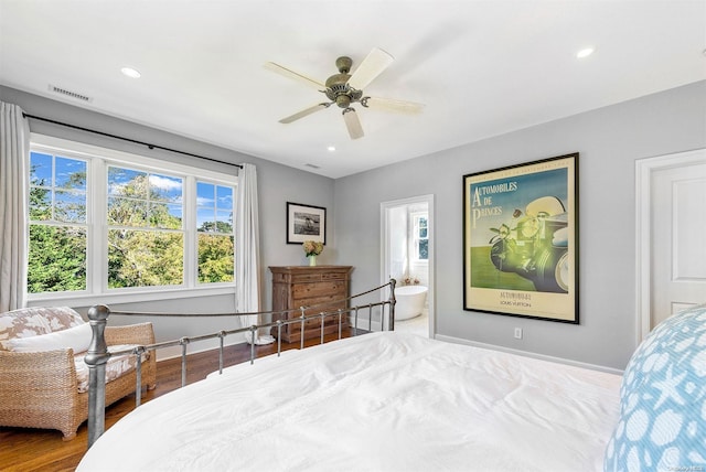 bedroom featuring light wood-type flooring, connected bathroom, and ceiling fan