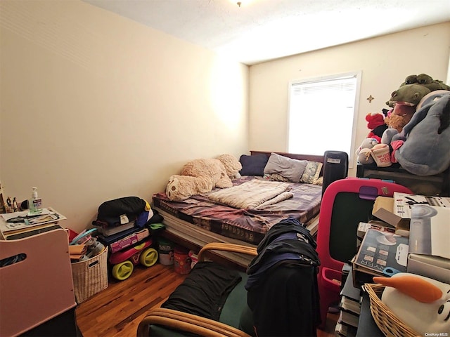 bedroom with wood-type flooring