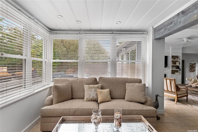 living room with tile patterned floors and ceiling fan