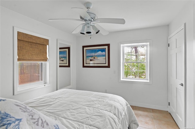 bedroom featuring ceiling fan and light tile patterned floors