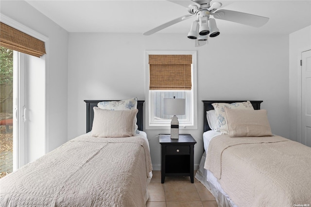 bedroom featuring ceiling fan and light tile patterned floors