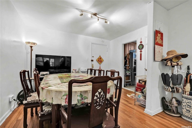 dining space featuring hardwood / wood-style flooring