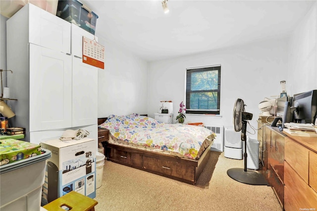 carpeted bedroom featuring radiator heating unit