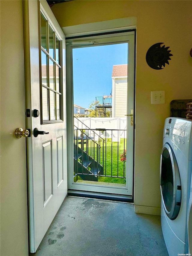 interior space featuring a wealth of natural light and washer / clothes dryer