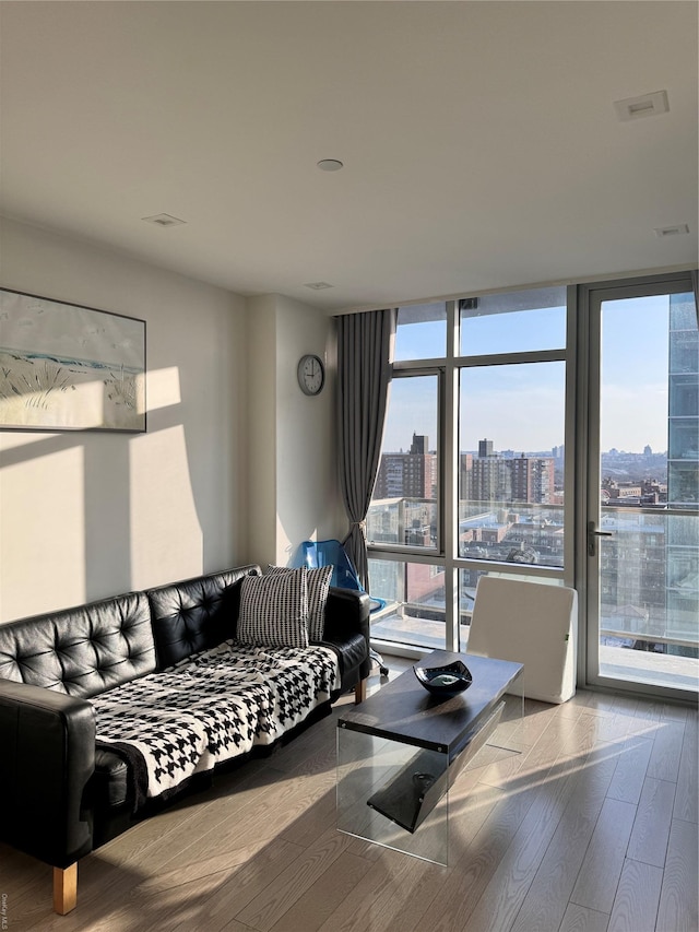 living room featuring hardwood / wood-style flooring and expansive windows