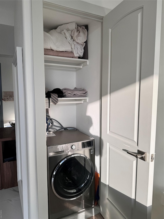 laundry room with washer / dryer