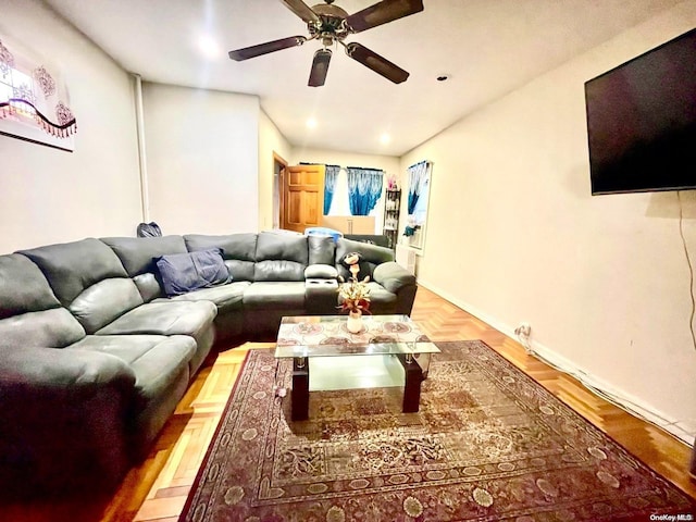 living room featuring light parquet flooring and ceiling fan