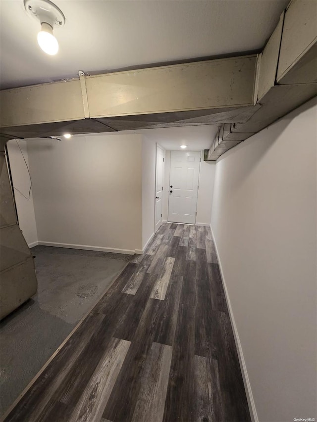 hallway with dark hardwood / wood-style floors